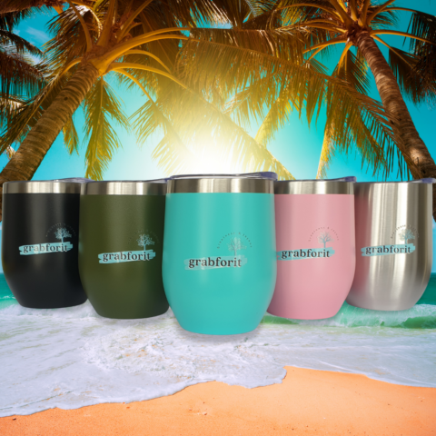 Wine Tumblers on a beach behind a sunset