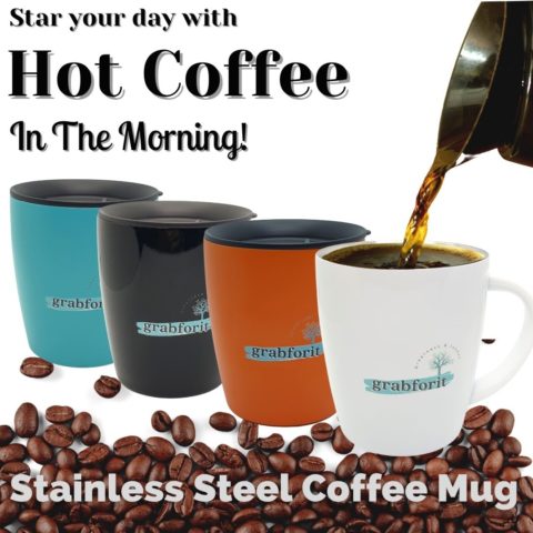 Four coffee mugs sitting on coffee beans